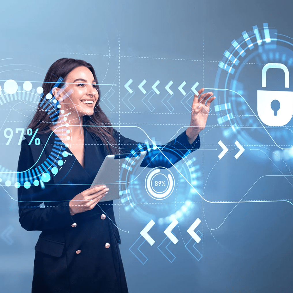 A woman in business attire uses a tablet, interacting with virtual cybersecurity and data protection graphics, including a padlock icon and digital progress indicators.